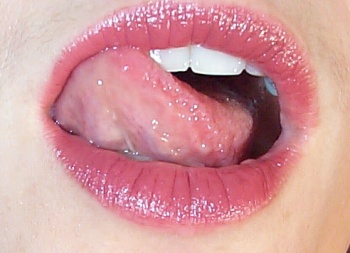Lara's lusciously lipsticked lips.