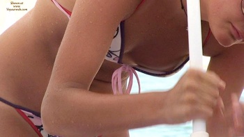 A bikini downblouse showing her nipple