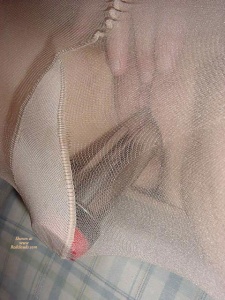 Vibrator kept in place by her pantyhose