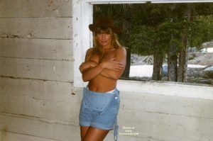 Deanne not topless, wearing a hat
