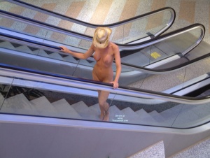 Bexx riding an escalator and avoiding getting her clothes caught