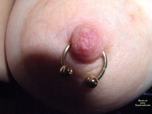 Pierced nipple ring on Patti's nipple