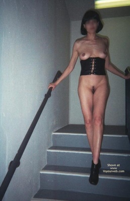 Naked in Hotel parking garage stairwell