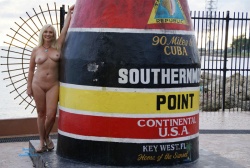 Delores posing naked at the marker for the Southernmost tip of Florida