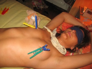 Clothespins on her nipples during soft bondage